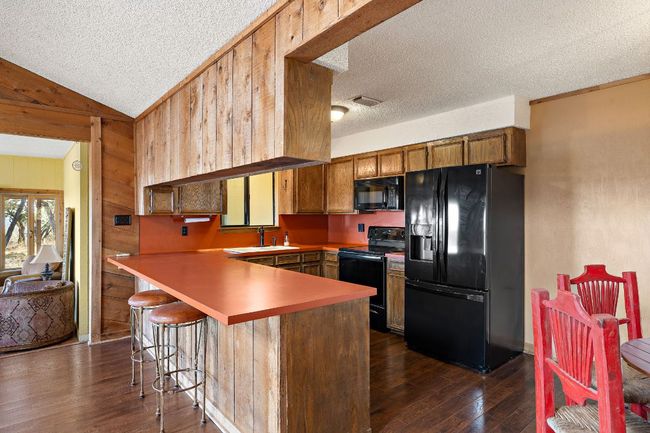 Kitchen featuring breakfast bar | Image 16