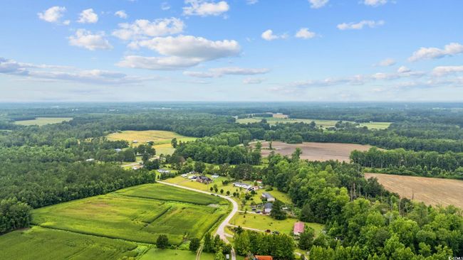 Overview of rural landscape featuring a heavily wooded area | Image 38