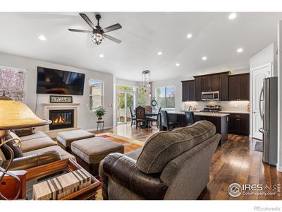 cast stone gas fireplace with manual wall switch - 12 vaulted ceilings with can & ceiling fan lights | Image 2