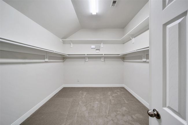 The large walk-in closet allows plenty of room for all your hanging clothes! Added shelving along the top wall maximizes storage. | Image 20