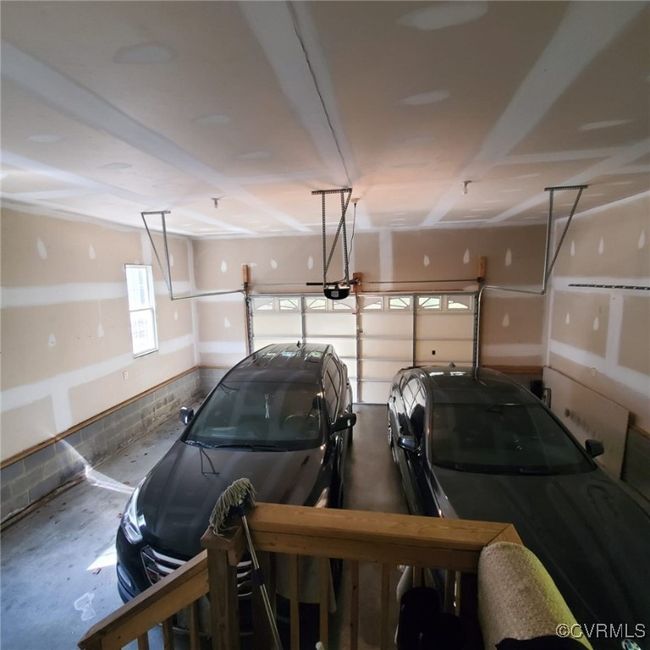 Garage with a garage door opener | Image 11