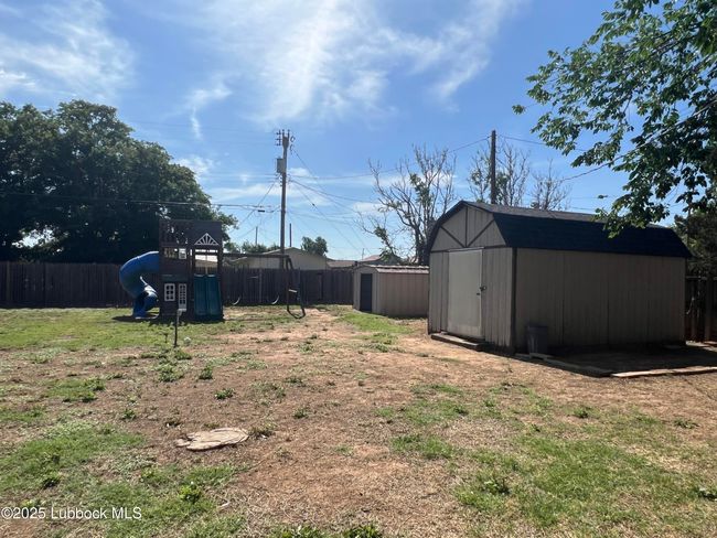 Large Backyard with 2 Storage Sheds | Image 19