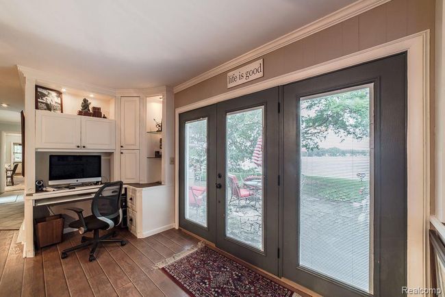 Large door wall leads out to the backyard patio | Image 24