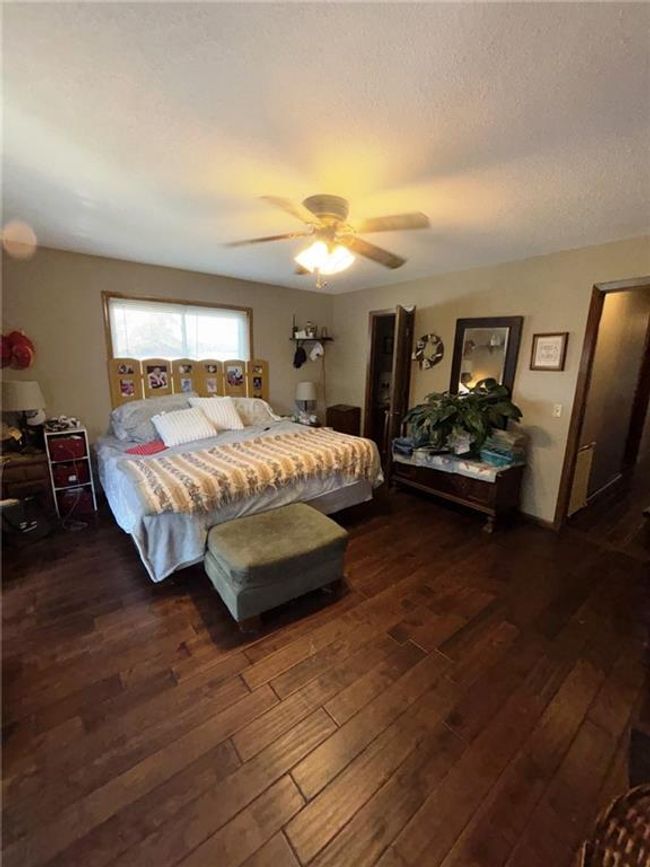 Master Bedroom featuring beautiful dark floors and lots of natural light | Image 20