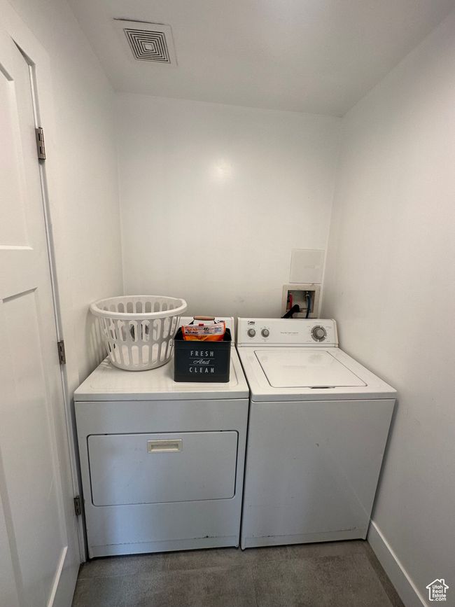 Washroom featuring separate washer and dryer and baseboards | Image 28