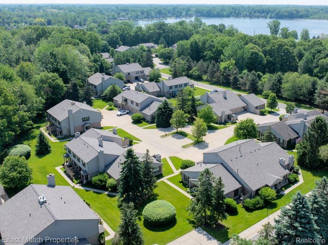 Complex is surrounded by woods and water. | Image 8