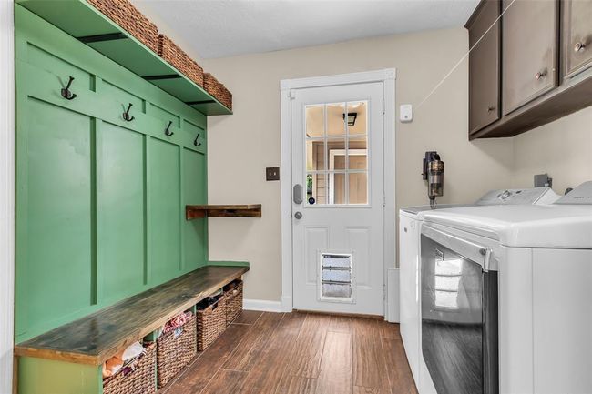 Thoughtfully designed custom mudroom—perfect for backpacks, shoes, and everyday essentials in the laundry room. | Image 34