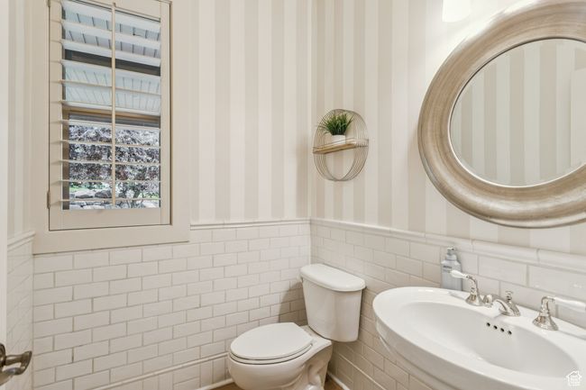 Half bath featuring wallpapered walls and wainscoting | Image 21