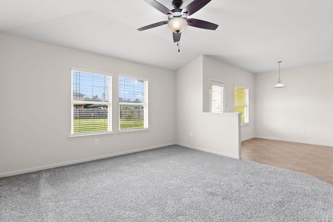 Empty room featuring healthy amount of natural light, baseboards, and ceiling fan | Image 26