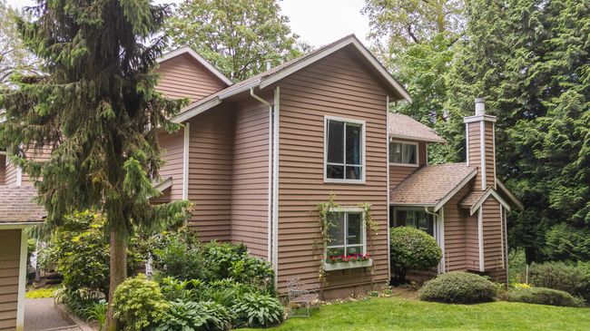 View of front of house with a chimney and a shingled roof | Image 18