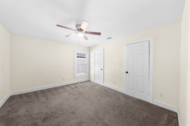 Unfurnished bedroom 3 with carpet, baseboards, and a ceiling fan | Image 19