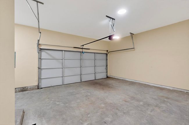 Garage featuring a garage door opener | Image 37