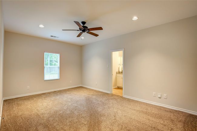 Empty room featuring light carpet, ceiling fan, and recessed lighting | Image 17