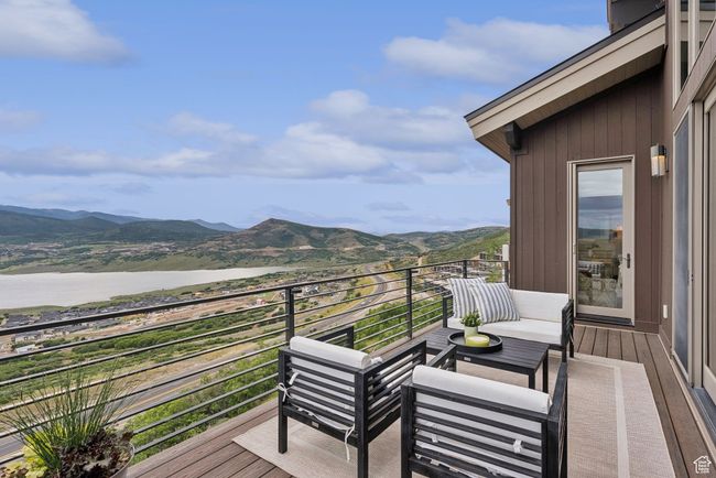 Balcony with a water and mountain view and outdoor lounge area | Image 59