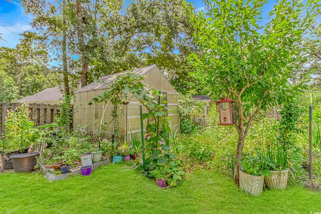 View of yard featuring an exterior structure and an outdoor structure | Image 29