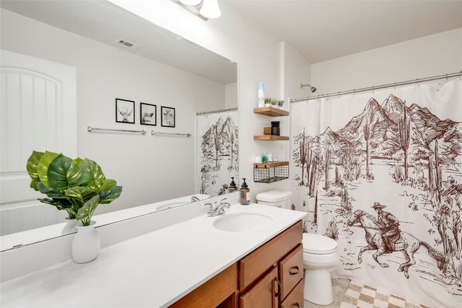 Full bathroom featuring vanity and a shower with shower curtain | Image 17