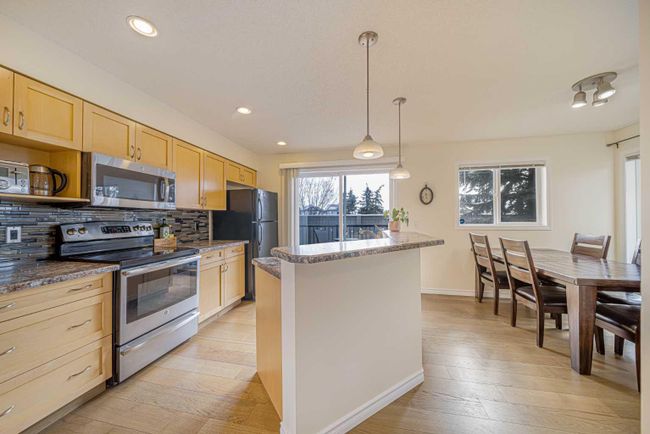50 Panatella Park Nw, Home with 4 bedrooms, 2 bathrooms and 2 parking in Calgary AB | Image 4