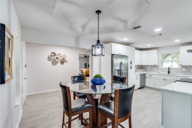 Dining area featuring light wood-style flooring, recessed lighting, and a ceiling fan | Image 14