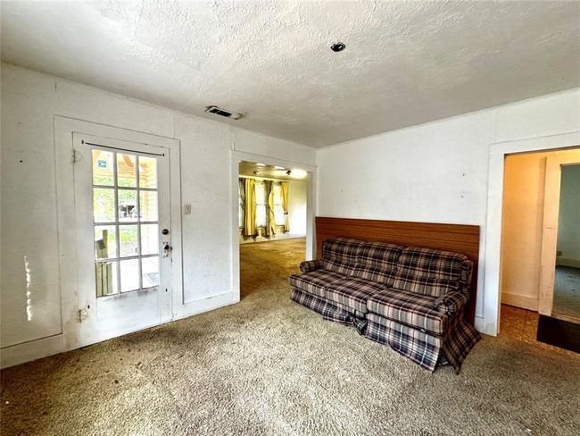 Dining room looking into living room and hallway to bedrooms. Soft spots in the floors. Be CAREFUL where you step. | Image 13