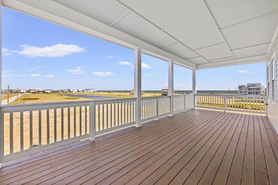 Enjoy the sunrise & water views from the east facing covered decks with recessed lighting. Note the deck boards are already stained for you! | Image 3