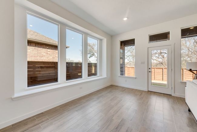 View of unfurnished sunroom | Image 11