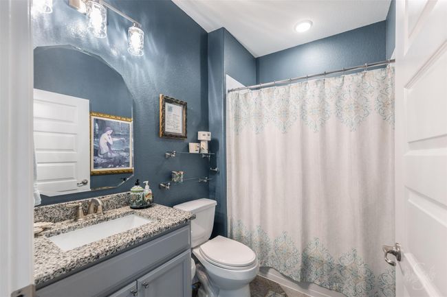 The secondary bathroom is modern and inviting, featuring contemporary fixtures and bright lighting. | Image 26