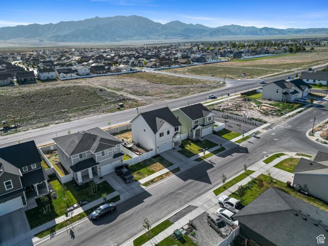 Aerial perspective of suburban area featuring a mountain backdrop | Image 32