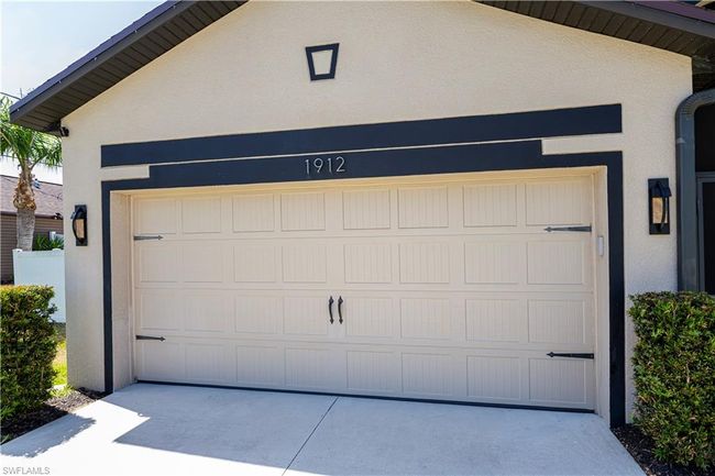 Garage featuring driveway | Image 30