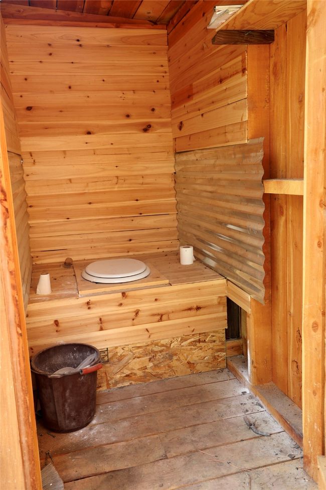Relaxing sauna / steam room featuring hardwood / wood-style flooring, wood ceiling, and wood walls | Image 18