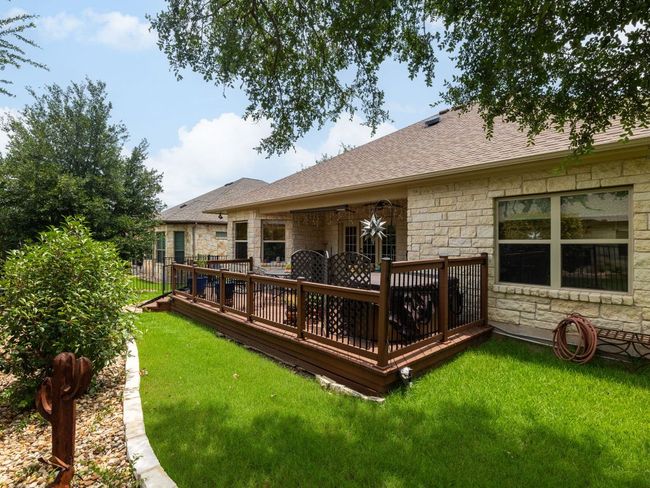 Back of home - spa / hot tub is on the patio / deck | Image 24