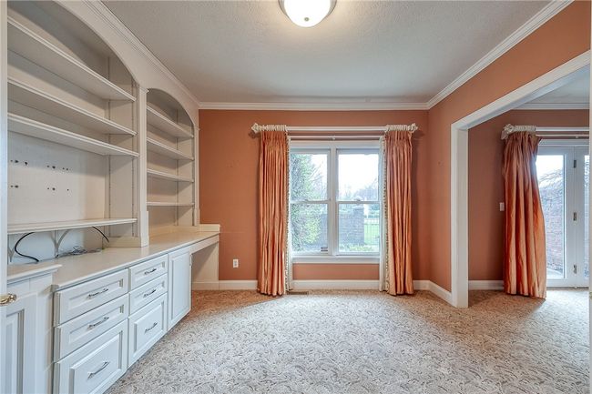 Den that is accessed from hall and connected to master bedroom | Image 29