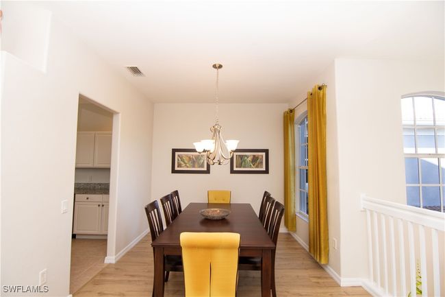 Seating for 6 guests at your dining room just off the kitchen. | Image 12