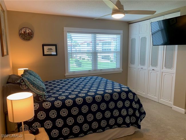 Main bedroom with a closet, ceiling fan | Image 15