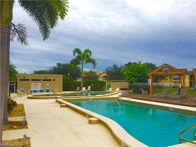 Community pool featuring a gazebo, a patio area, and fence | Image 29