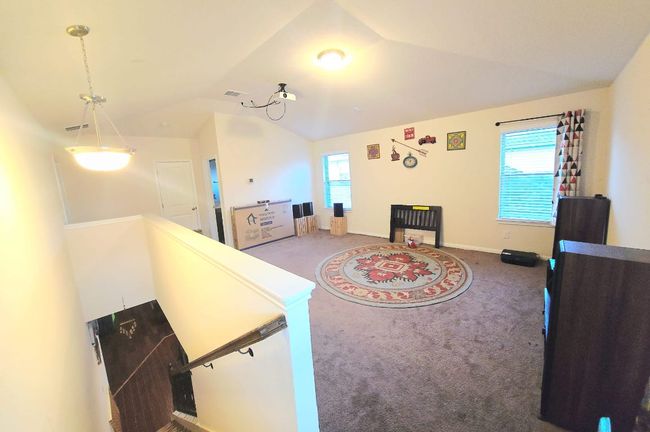 Living area with carpet and lofted ceiling | Image 21