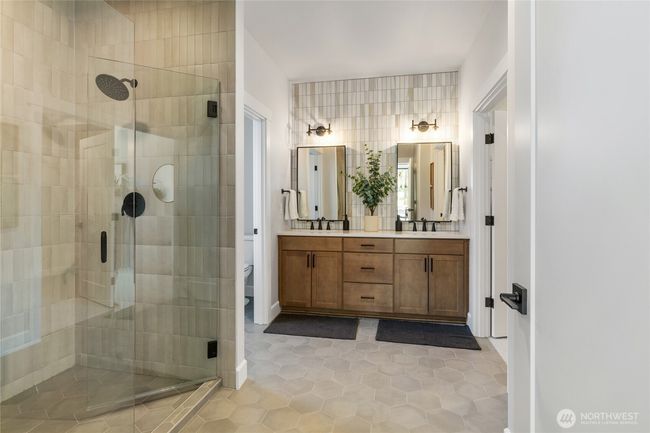 Primary bath walk in shower and double vanity. | Image 24