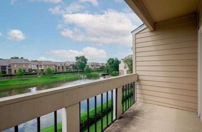 Balcony featuring a water view and a residential view | Image 24