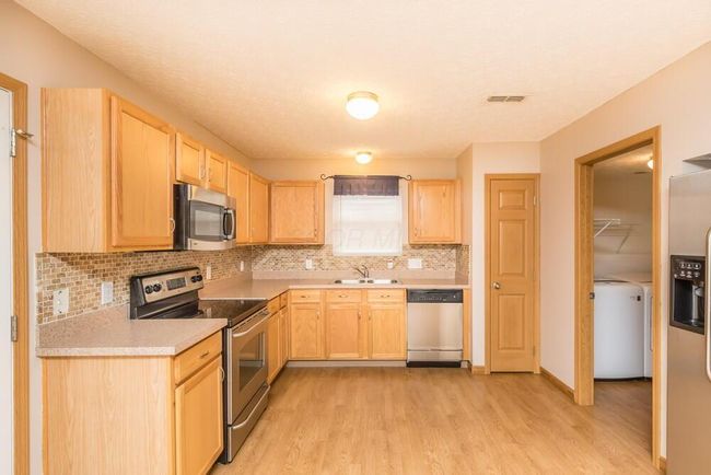 5975 Pennington Creek Dr, Condo with 3 bedrooms, 3 bathrooms and null parking in Dublin OH | Image 16