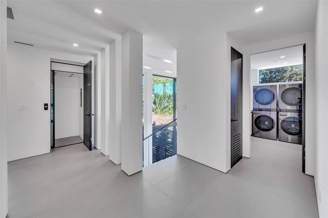 Practical Access Hall w/Seamless Access to Elevator and Laundry | Image 29