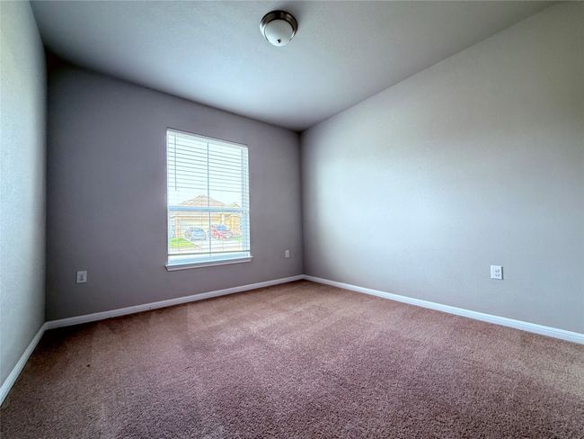 Unfurnished room with carpet floors and baseboards | Image 13