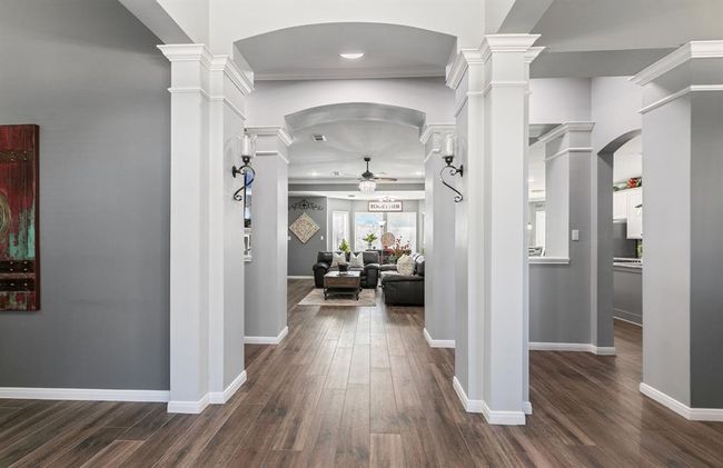 As you walk through the front door, you'll notice the many details and warm paint pallet throughout. The columns are impressive. | Image 7