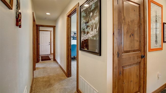 Hallway featuring light carpet, baseboards, and recessed lighting | Image 24