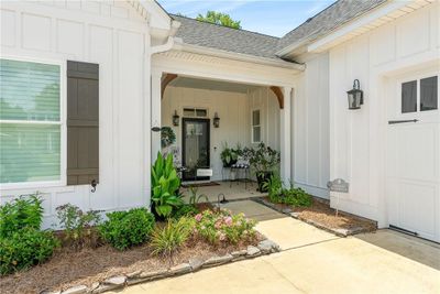 Covered front porch offers a warm, Southern welcome - it even has a haint blue ceiling! | Image 3