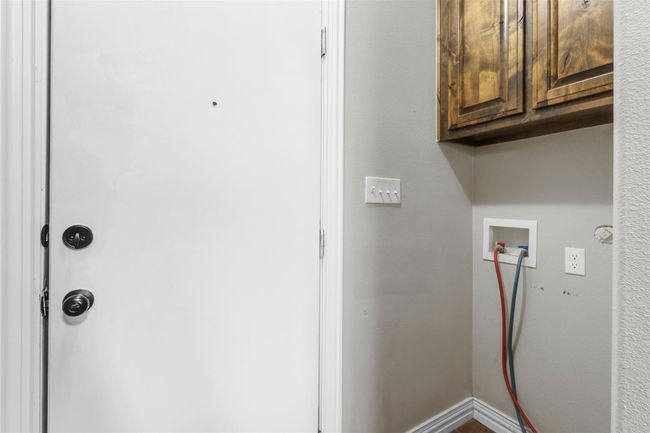 Laundry room with cabinet space and washer hookup | Image 13