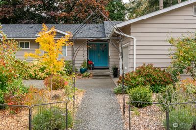 Delightful perennial garden welcomes you. All gardening spaces have been sheet mulched with a professional gardener and are chemical free. | Image 2