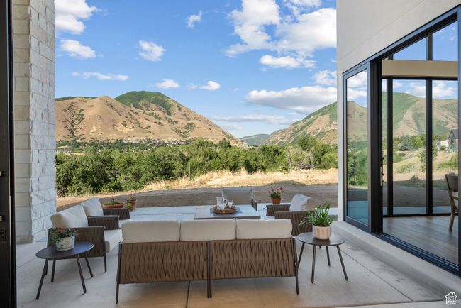 View of patio with a mountain view and outdoor lounge area | Image 20