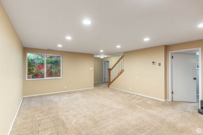 Interior space featuring stairway, light carpet, and recessed lighting | Image 28