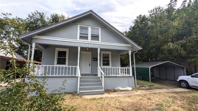 Bungalow-style house featuring covered porch and a carport | Image 3