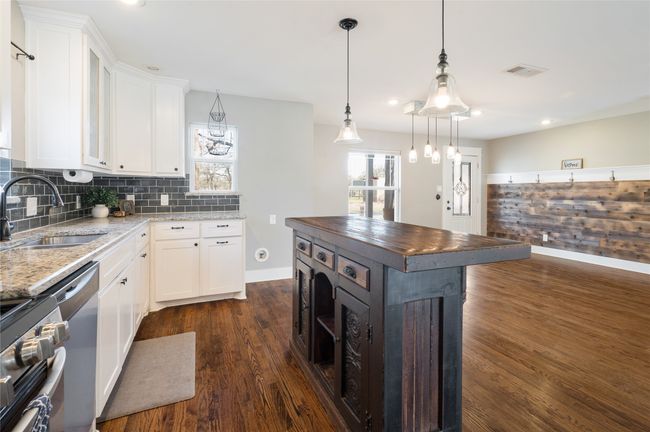 Kitchen is open to the dining and living room | Image 11