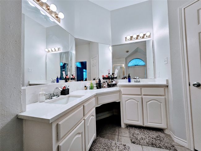 Full bath featuring tile patterned flooring, double vanity, and a shower | Image 22